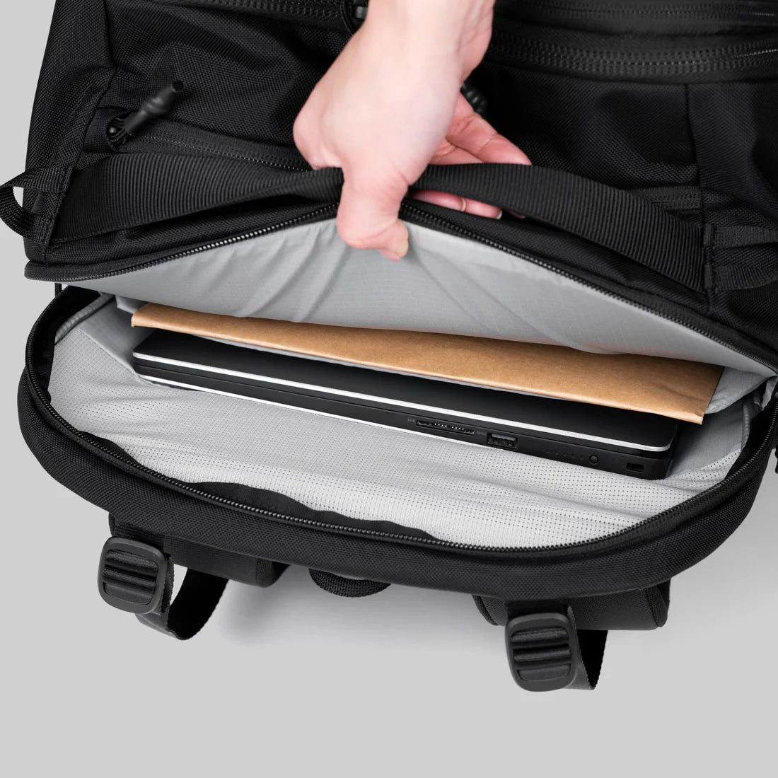 Multi-Pocket Travel Backpack with Luggage Pass-Through and Ergonomic Carrying Framework